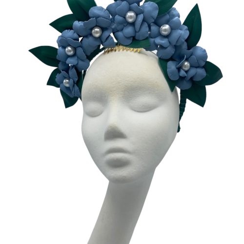 Large blue leather flower crown with green leather leaf detail.